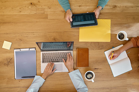 business people working at a coworking space overhead view
