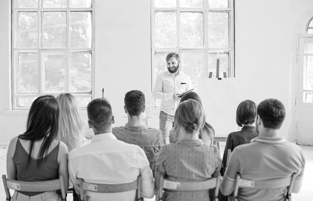 Speaker Business Meeting Conference Hall Bw Crop U2956 1024x659